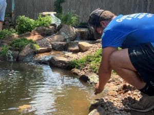Performing Pond Maintenance On An Oklahoma City Pond