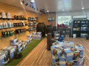 Inside the Oklahoma Ponds store with pond pumps, treatments, and fountain displays