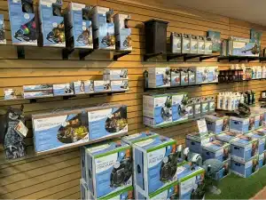 Pond lighting kits, pumps, and supplies on the shelves at the Oklahoma Ponds store
